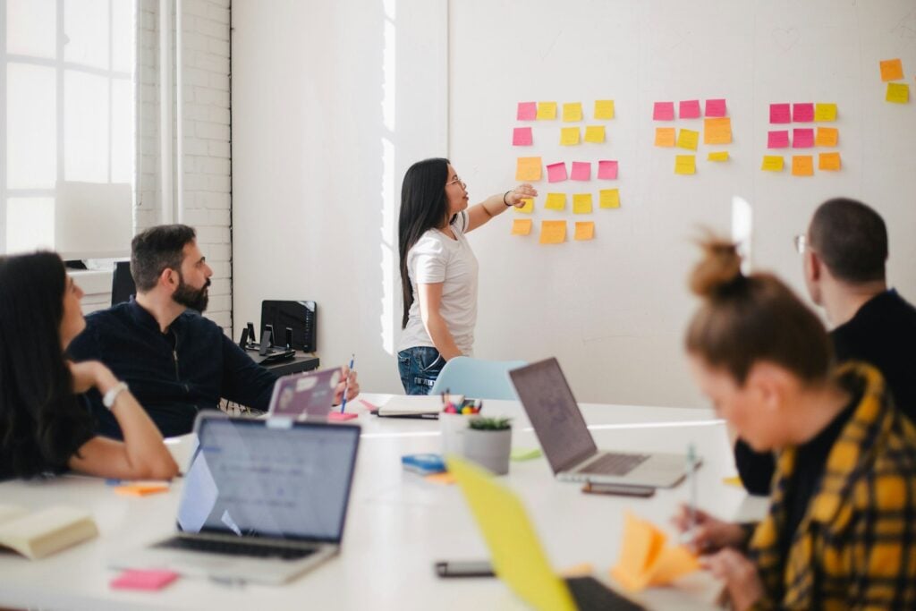Marketing team planning a small business campaign with sticky notes