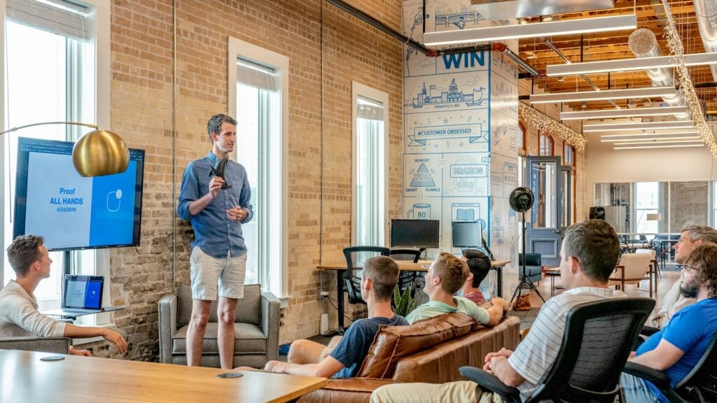 Small business owners meeting with a digital marketing agency strategist